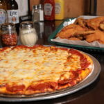 Monday Pizza and Wings special at Skinners Pub